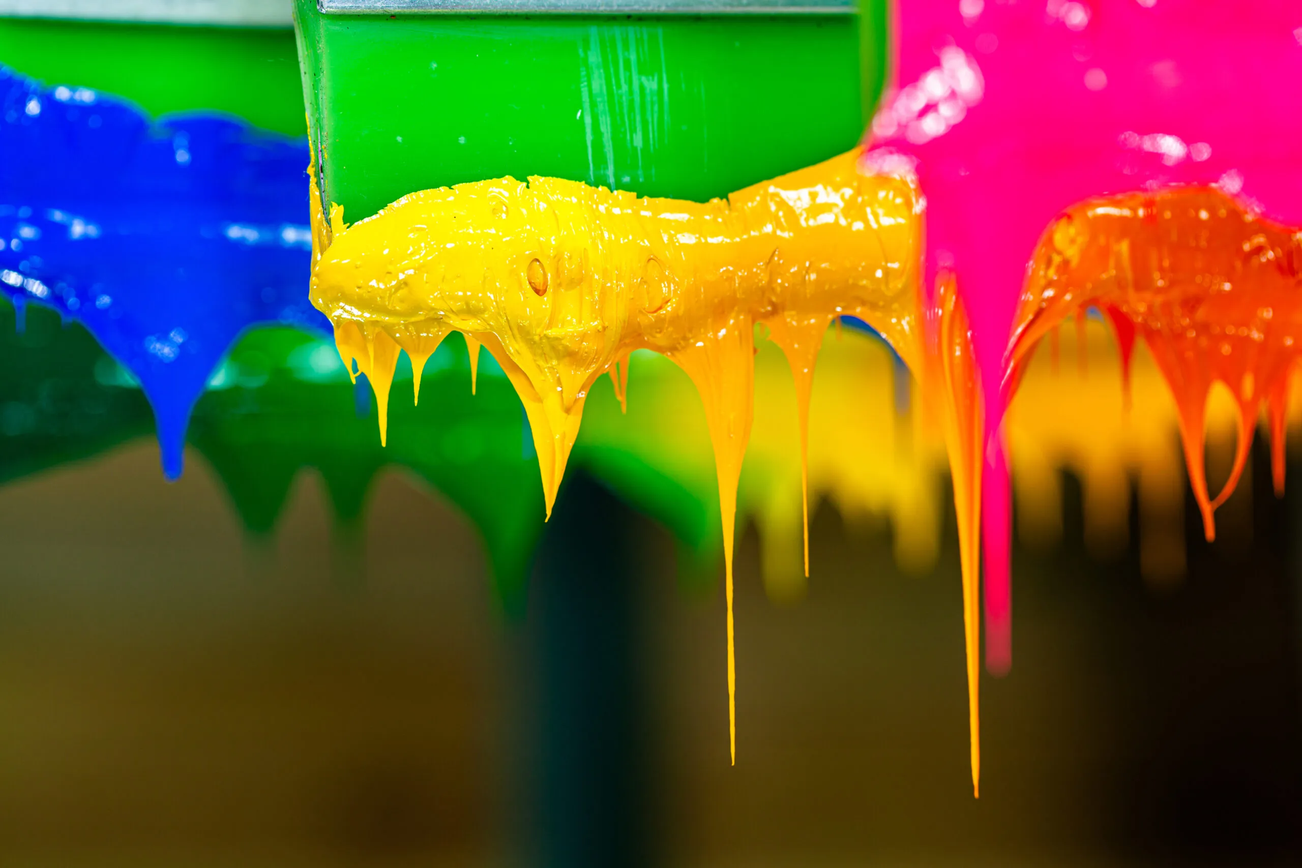 Blue, green, yellow and magenta printing inks running thick off the press ducts